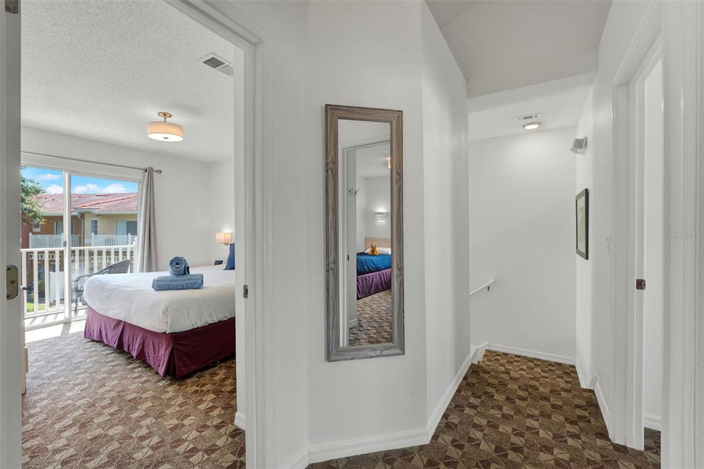 1086 Park Ridge Circle Kissimmee, FL 34746 - Photo 10 of 57 a spacious bedroom with a bed and a window