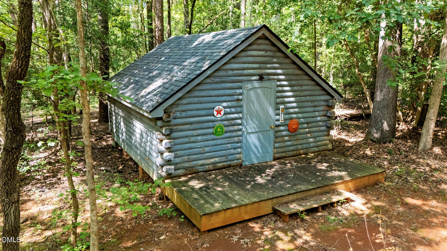 7391 Howerton Road Elon, NC 27244 - Photo 53 of 53 Log cabin structure with a gable roof and light blue exterior finish