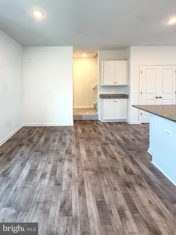 a white toilet sitting next to a white sink