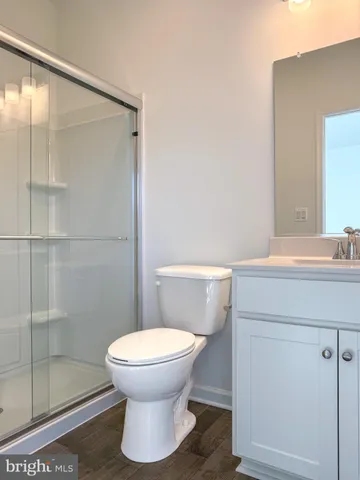 a bathroom with a toilet and a sink
