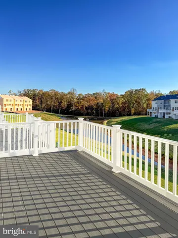 a view of wooden fence and a yard