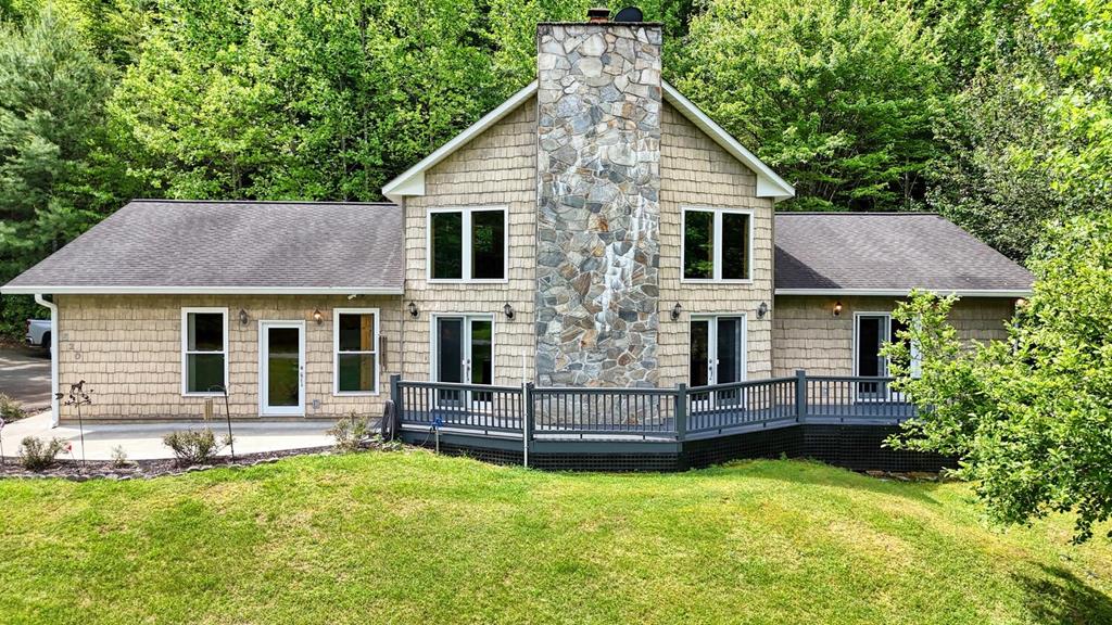 520 Brasstown Road Murphy, NC 28906 - Photo 1 of 61 a aerial view of a house with swimming pool next to a yard