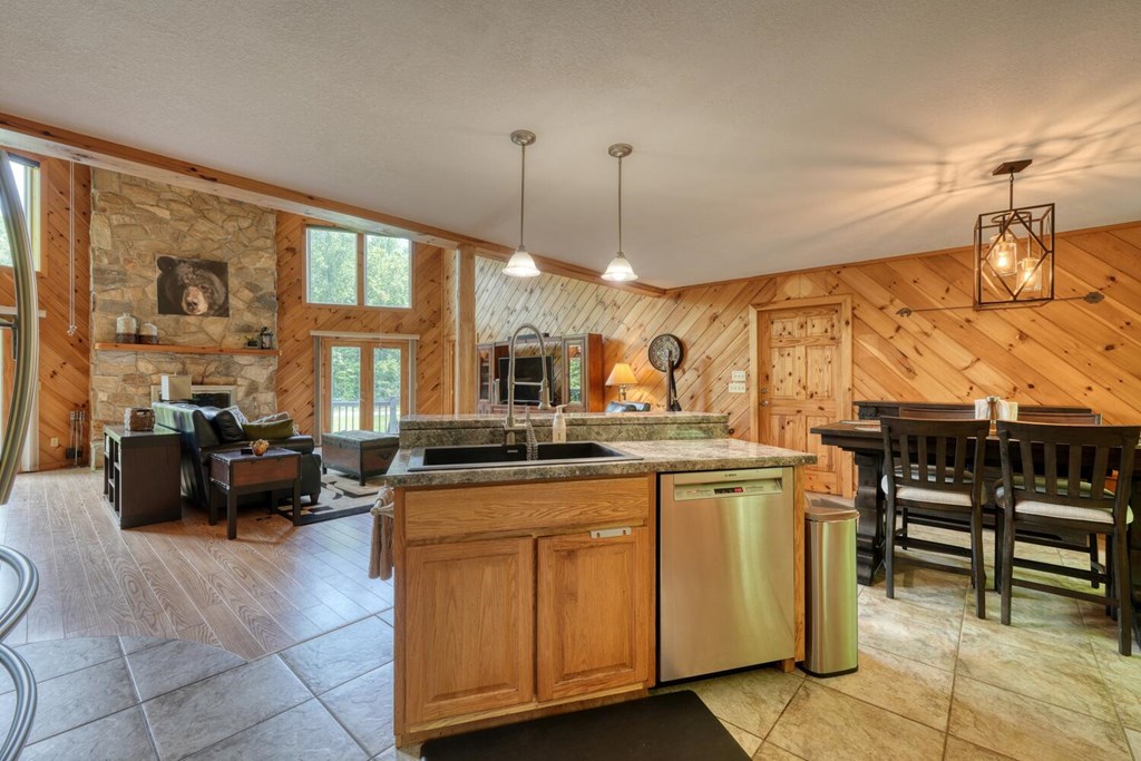 520 Brasstown Road Murphy, NC 28906 - Photo 20 of 61 a kitchen with a stove a sink and chairs