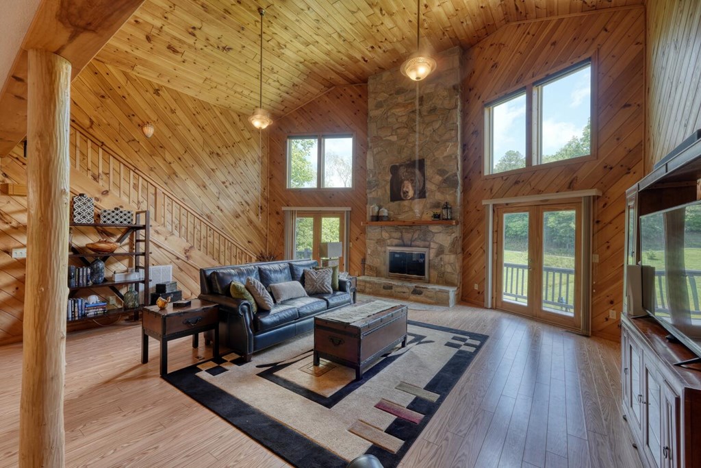 520 Brasstown Road Murphy, NC 28906 - Photo 3 of 61 a living room with furniture a fireplace and a table