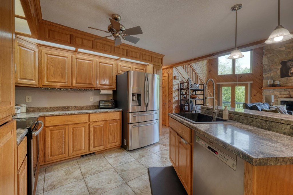 520 Brasstown Road Murphy, NC 28906 - Photo 4 of 61 a kitchen with stainless steel appliances granite countertop a sink a stove and a refrigerator