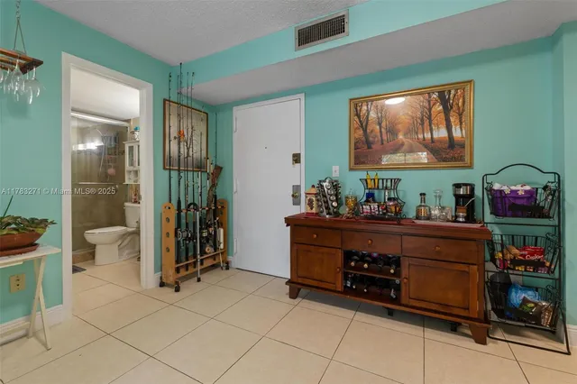 a kitchen with stainless steel appliances granite countertop a stove and a microwave