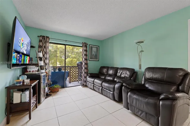 a area with furniture and a flat screen tv