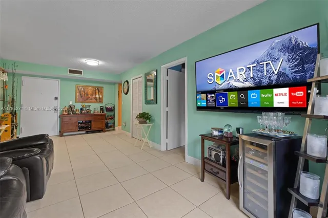 a kitchen with stainless steel appliances a refrigerator and a stove top oven