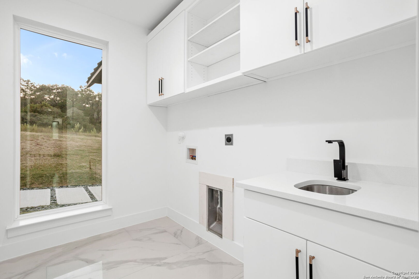 3079 Campestres Spring Branch, TX 78070 - Photo 22 of 38 a kitchen with a sink and a window
