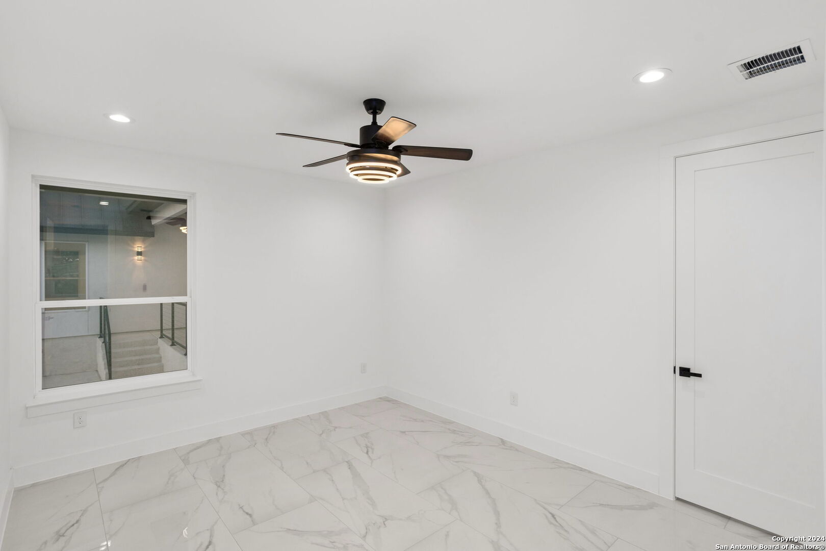 3079 Campestres Spring Branch, TX 78070 - Photo 26 of 38 a view of a livingroom with a ceiling fan and window