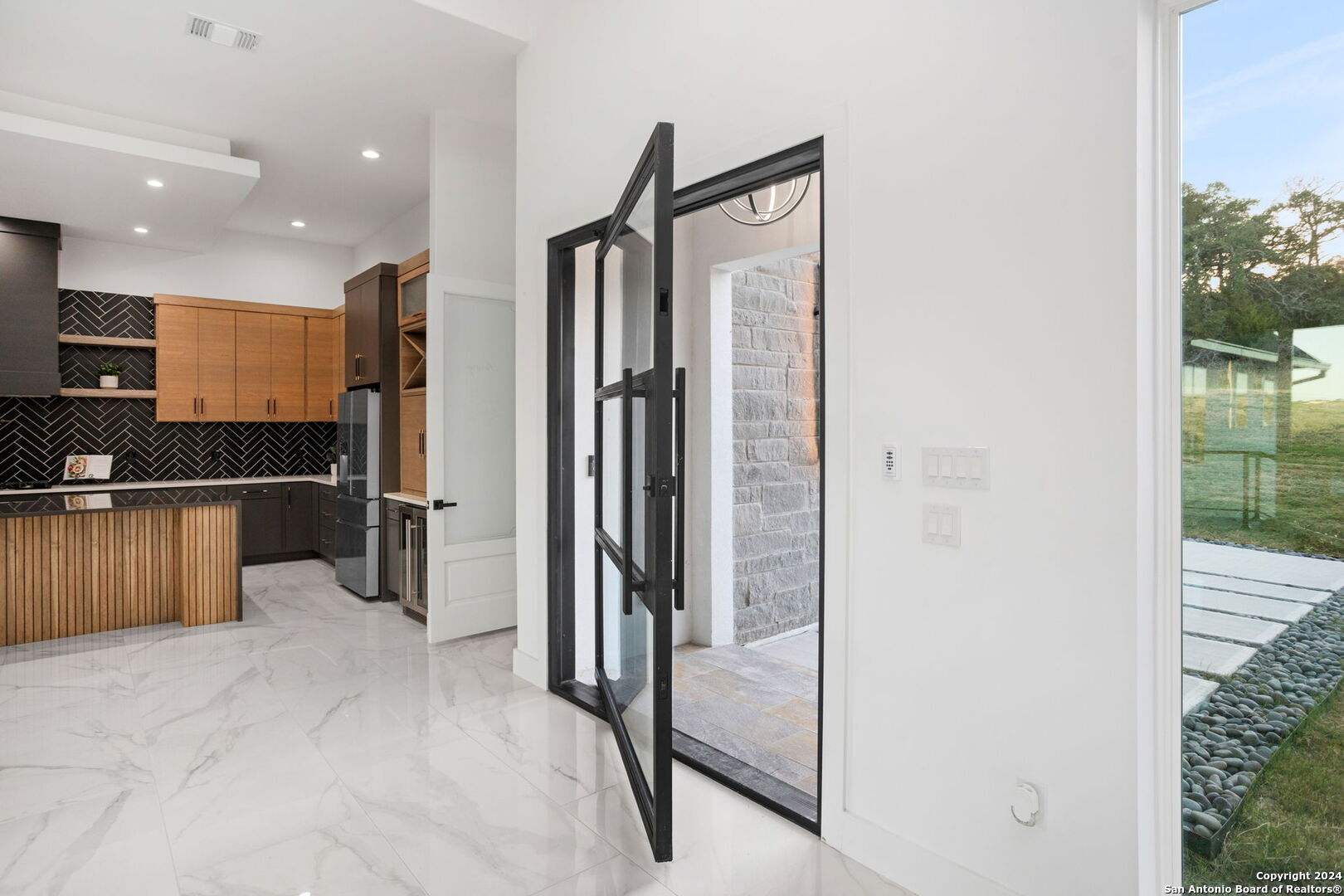 3079 Campestres Spring Branch, TX 78070 - Photo 6 of 38 a view of a kitchen with a refrigerator and a counter top space
