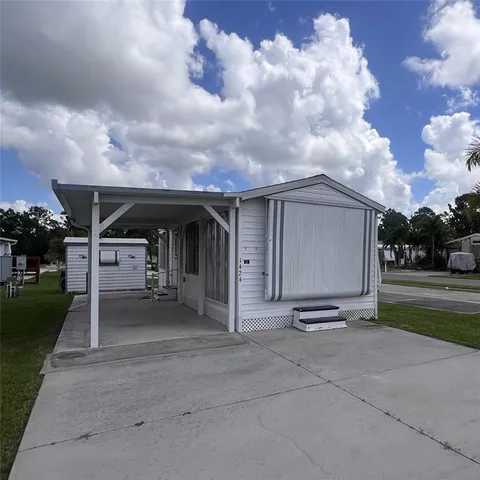 a view of a car park in front of house