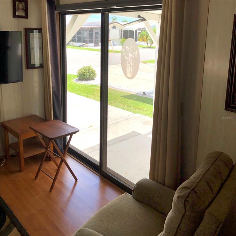 1424 Trout Punta Gorda, FL 33950 - Photo 11 of 32 a living room with furniture and a window