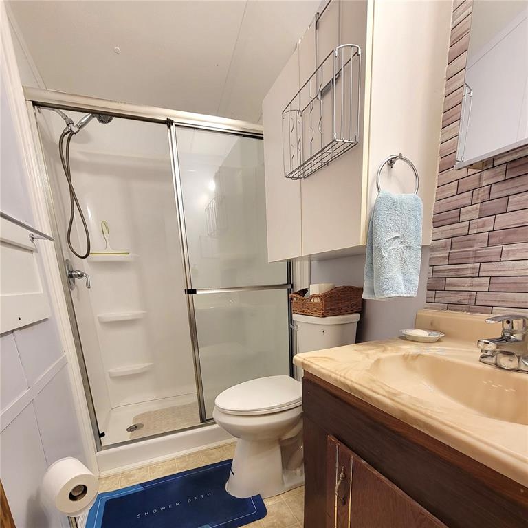 1424 Trout Punta Gorda, FL 33950 - Photo 13 of 32 a bathroom with a sink toilet and shower