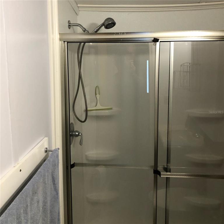 1424 Trout Punta Gorda, FL 33950 - Photo 15 of 32 a bathroom with a glass shower door