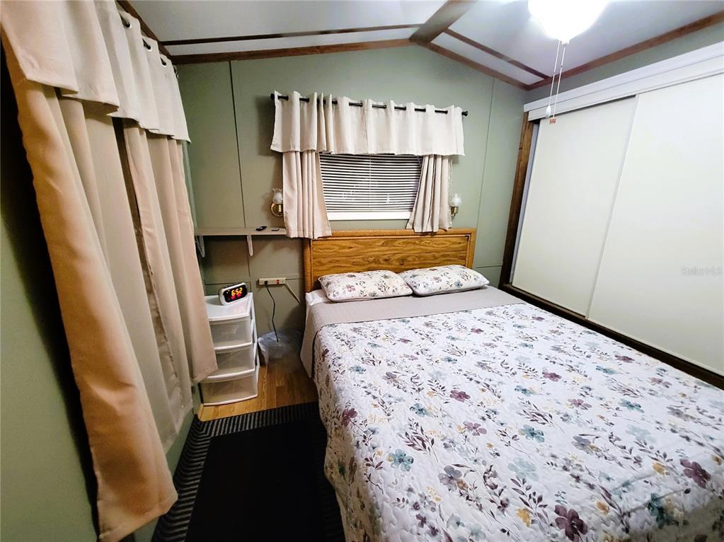 1424 Trout Punta Gorda, FL 33950 - Photo 16 of 32 a bedroom with a bed wooden floor and a window