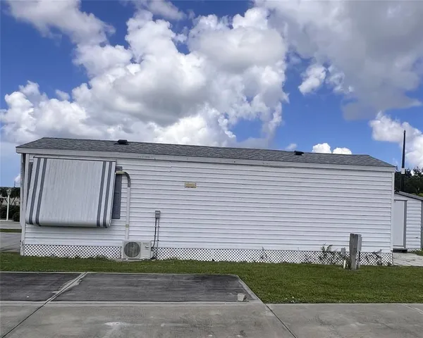 a view of multiple house with a ocean view