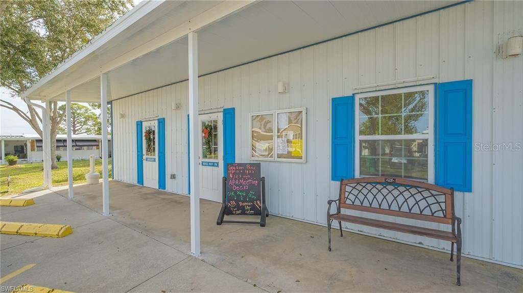 1424 Trout Punta Gorda, FL 33950 - Photo 27 of 32 a view of a porch with a bench and floor to ceiling window