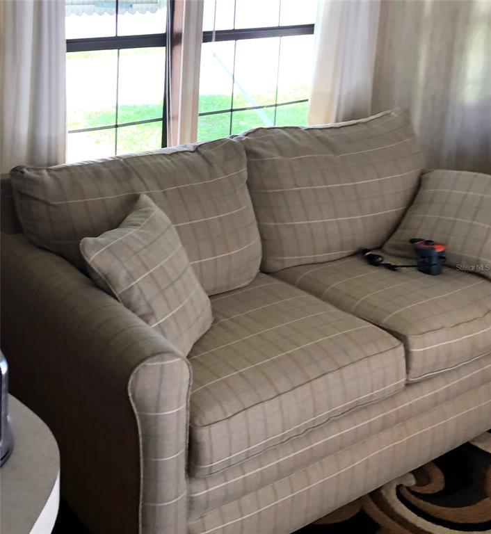 1424 Trout Punta Gorda, FL 33950 - Photo 9 of 32 a living room with furniture and a window