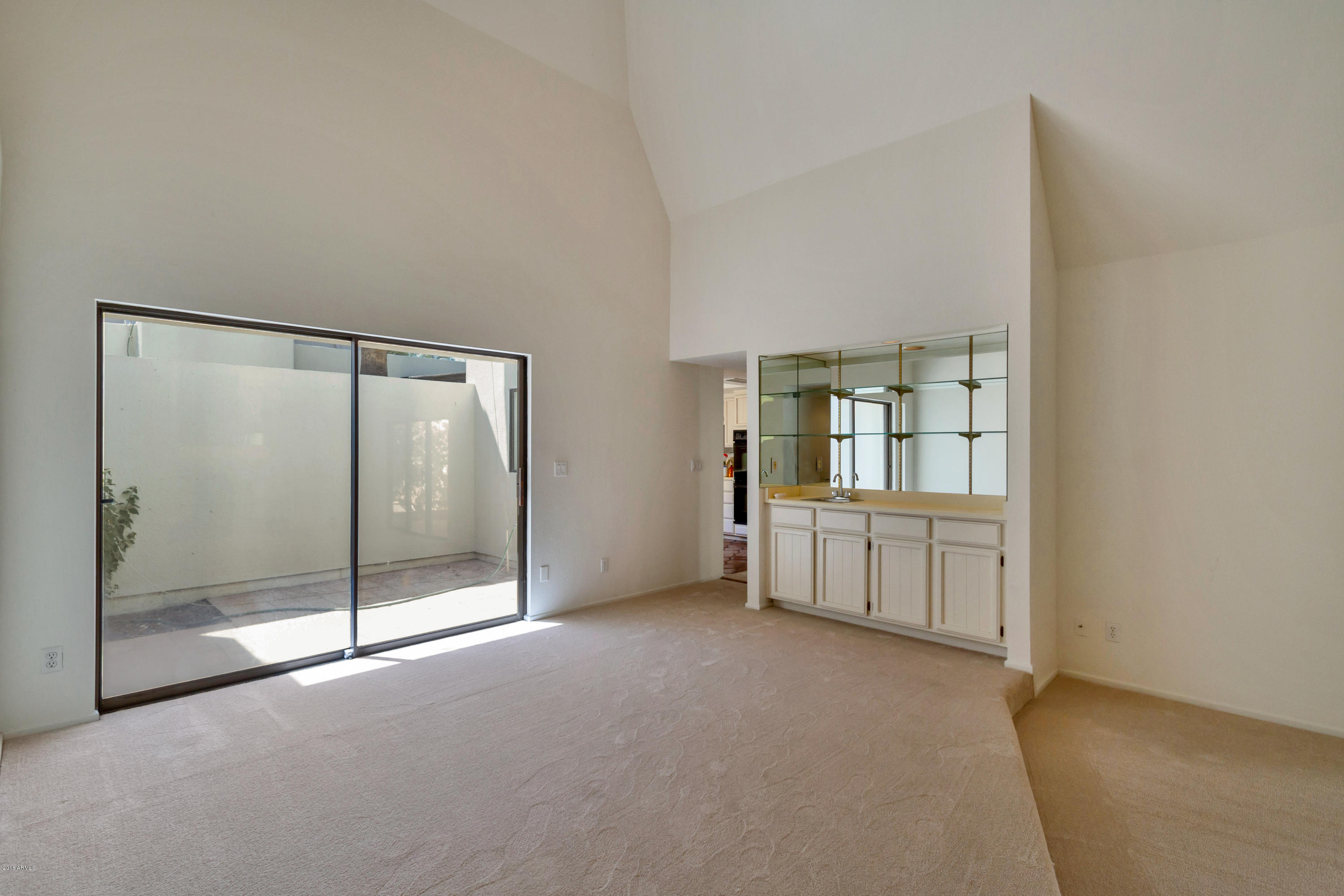 5310 North 24th Place Phoenix, AZ 85016 - Photo 12 of 21 a view of an empty room with window