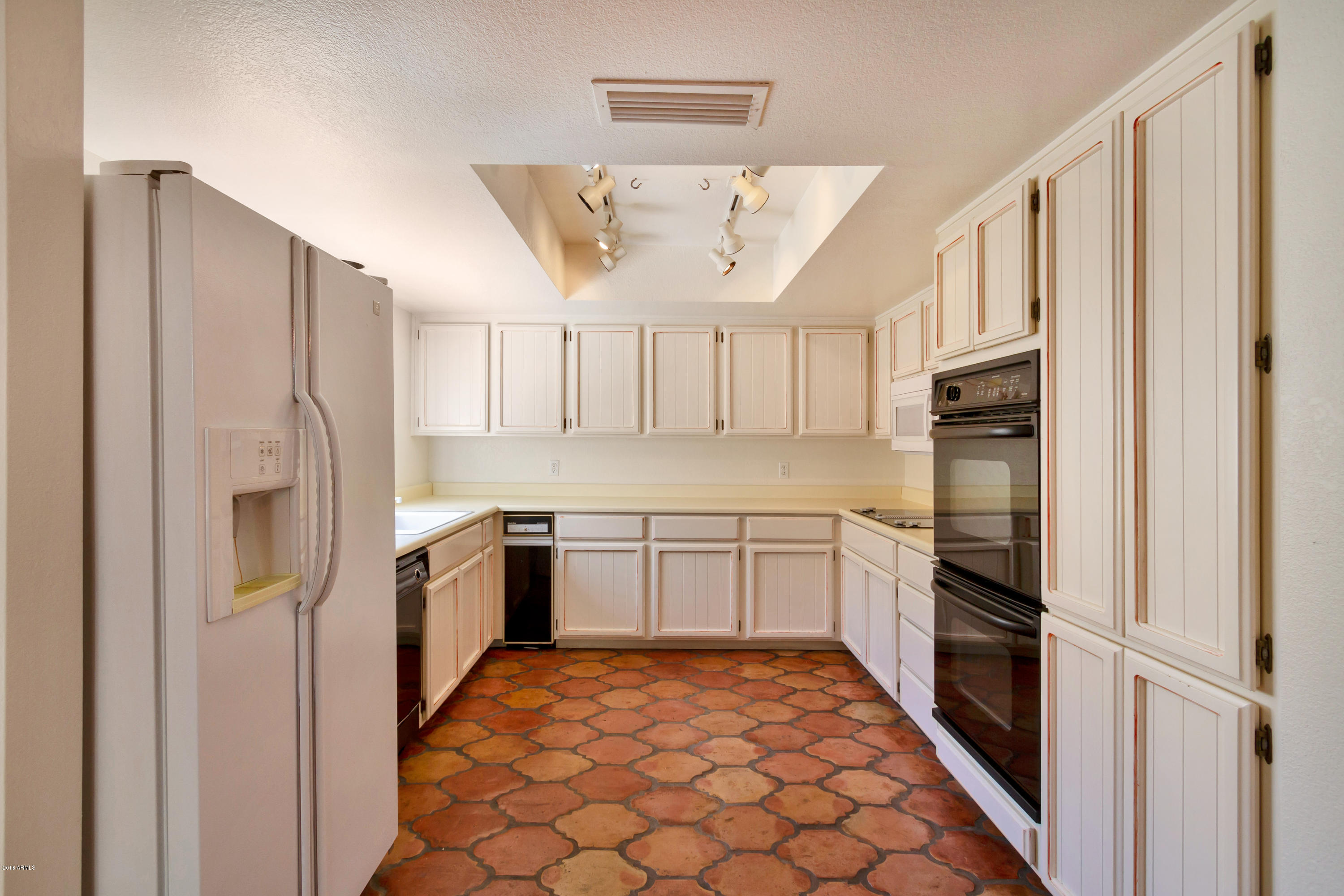5310 North 24th Place Phoenix, AZ 85016 - Photo 14 of 21 a kitchen with stainless steel appliances granite countertop a refrigerator and a sink