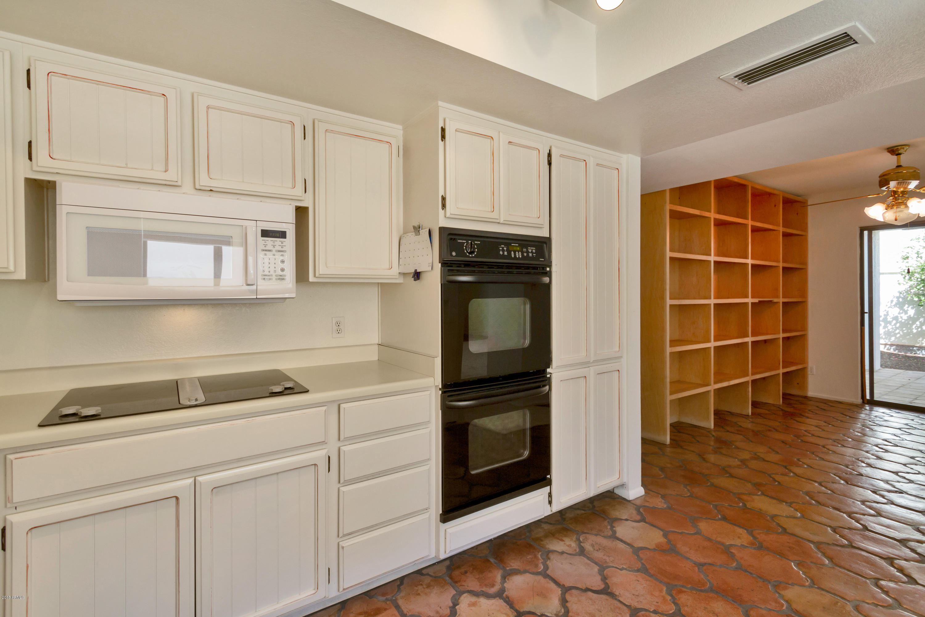5310 North 24th Place Phoenix, AZ 85016 - Photo 15 of 21 a kitchen with cabinets and window