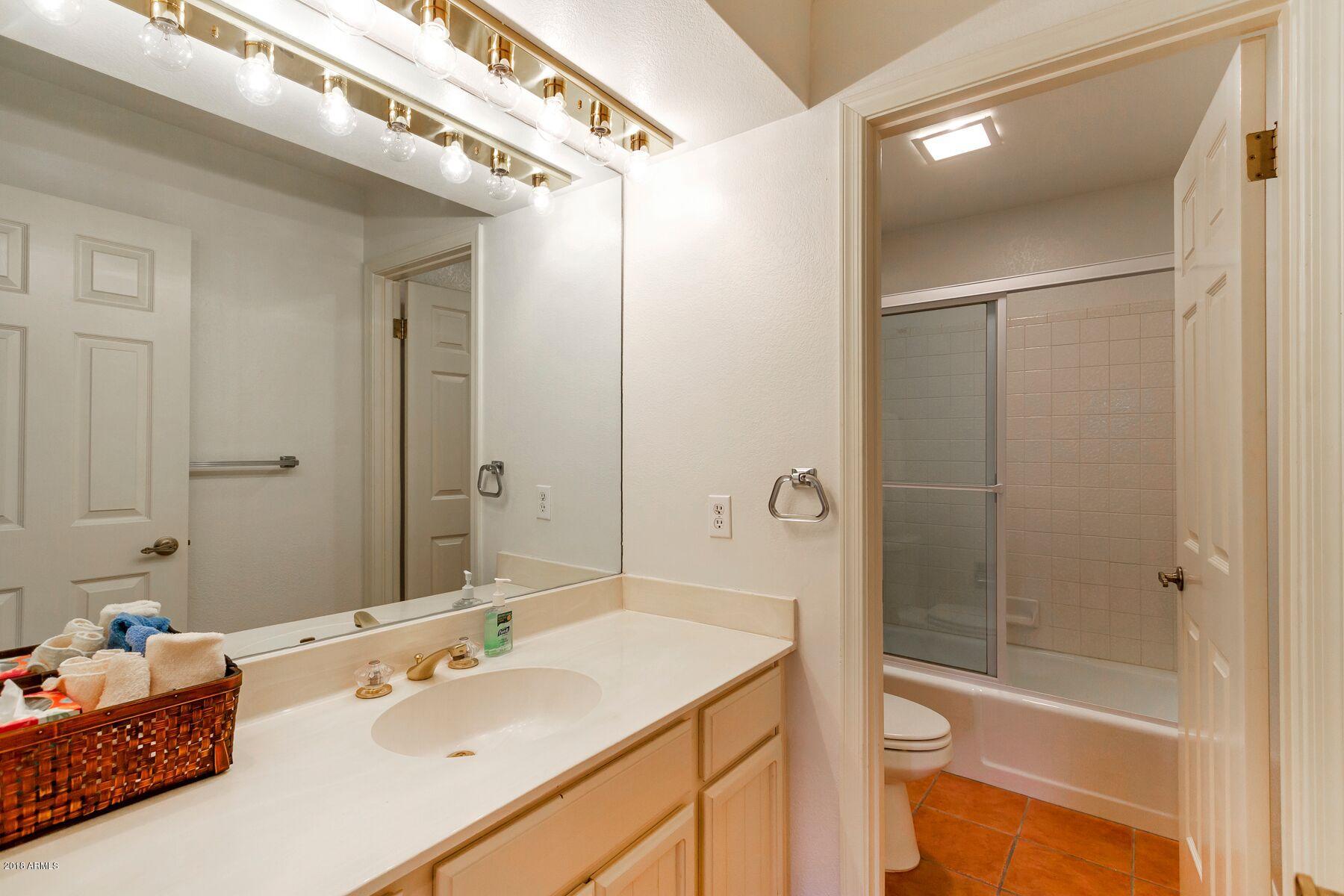 5310 North 24th Place Phoenix, AZ 85016 - Photo 17 of 21 a bathroom with a sink toilet and shower