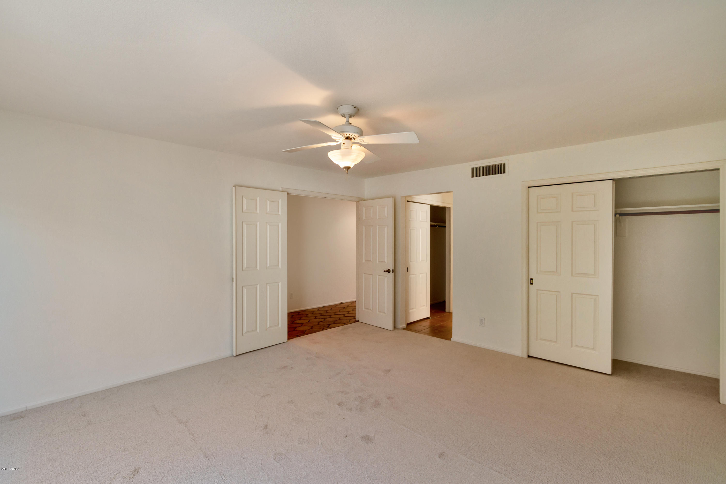 5310 North 24th Place Phoenix, AZ 85016 - Photo 4 of 21 a view of an empty room with a ceiling fan