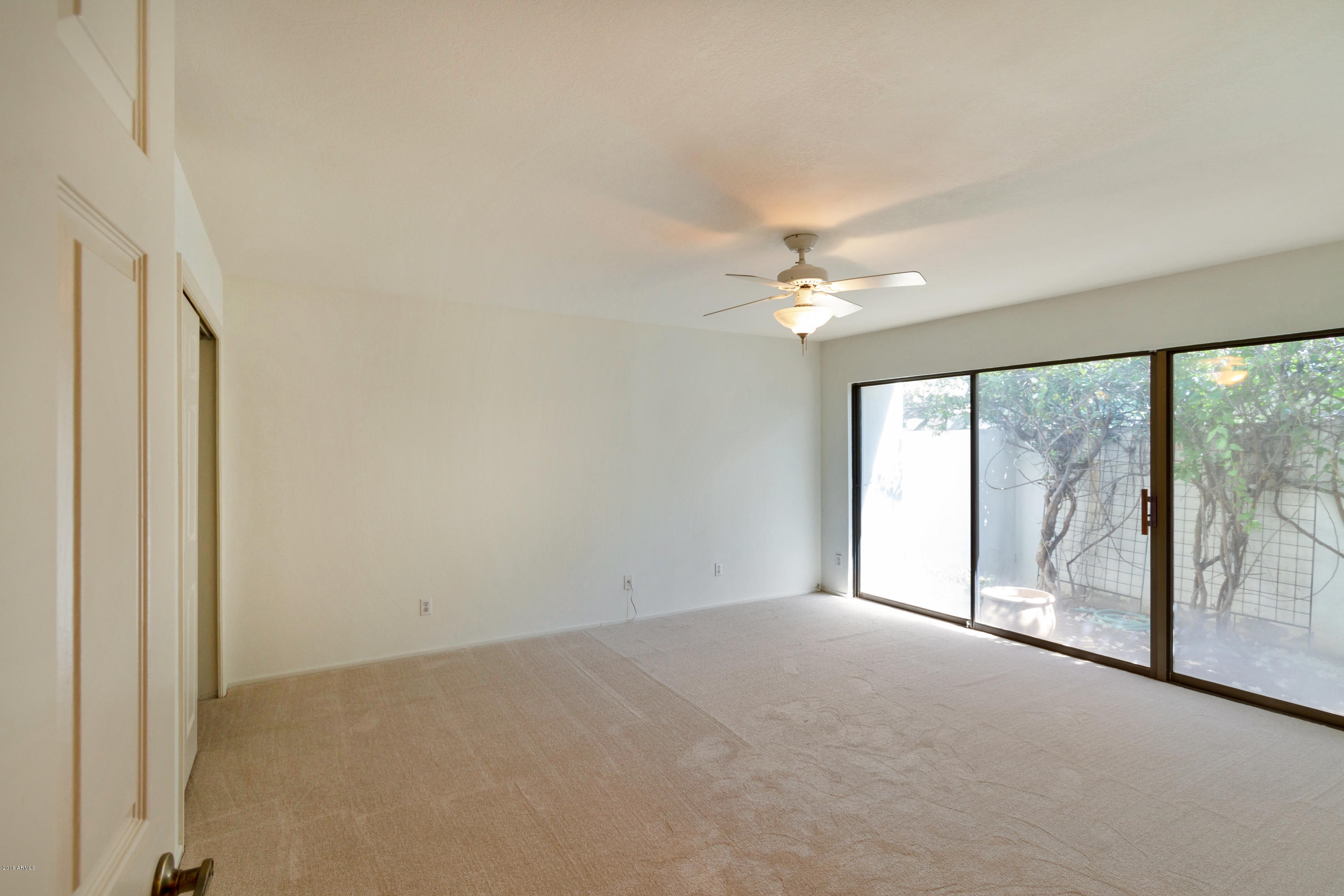 5310 North 24th Place Phoenix, AZ 85016 - Photo 7 of 21 a view of a livingroom with a ceiling fan and window