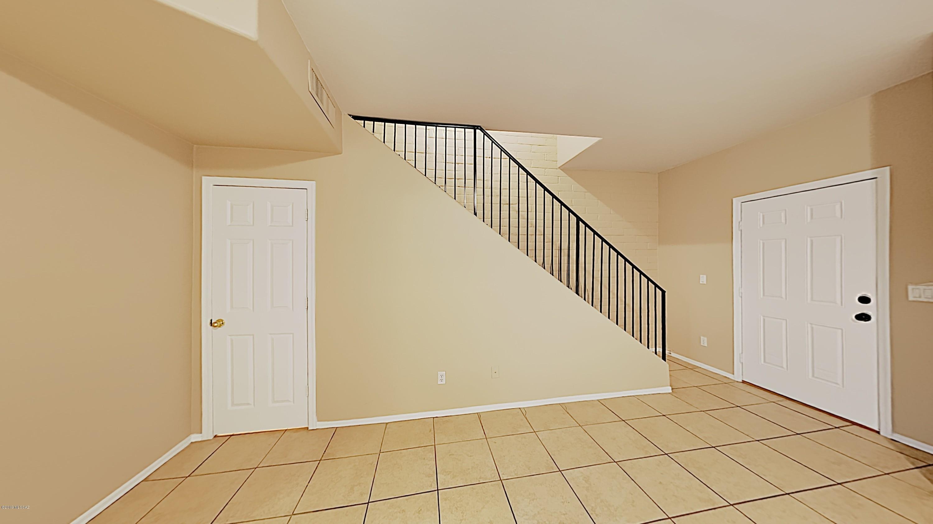 3516 South Mission Road, Unit 3 Tucson, AZ 85713 - Photo 6 of 19 a view of an entryway with wooden floor