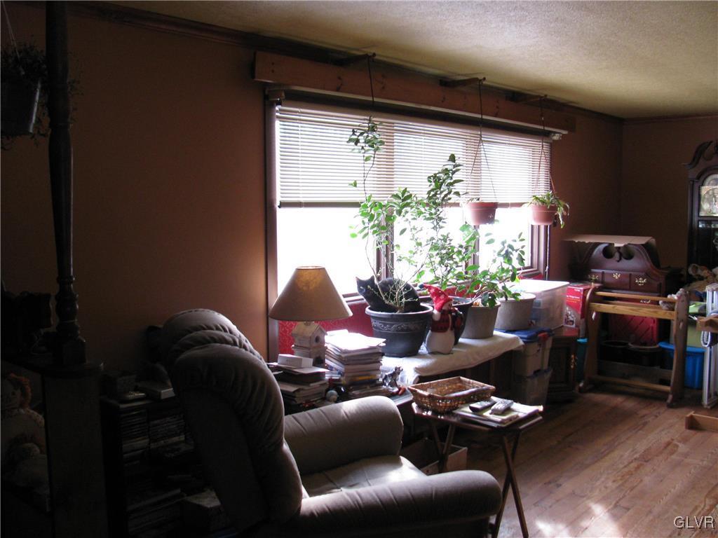 434 Shooktown Road Bangor, PA 18013 - Photo 14 of 36 a living room with furniture a potted plant and a large window