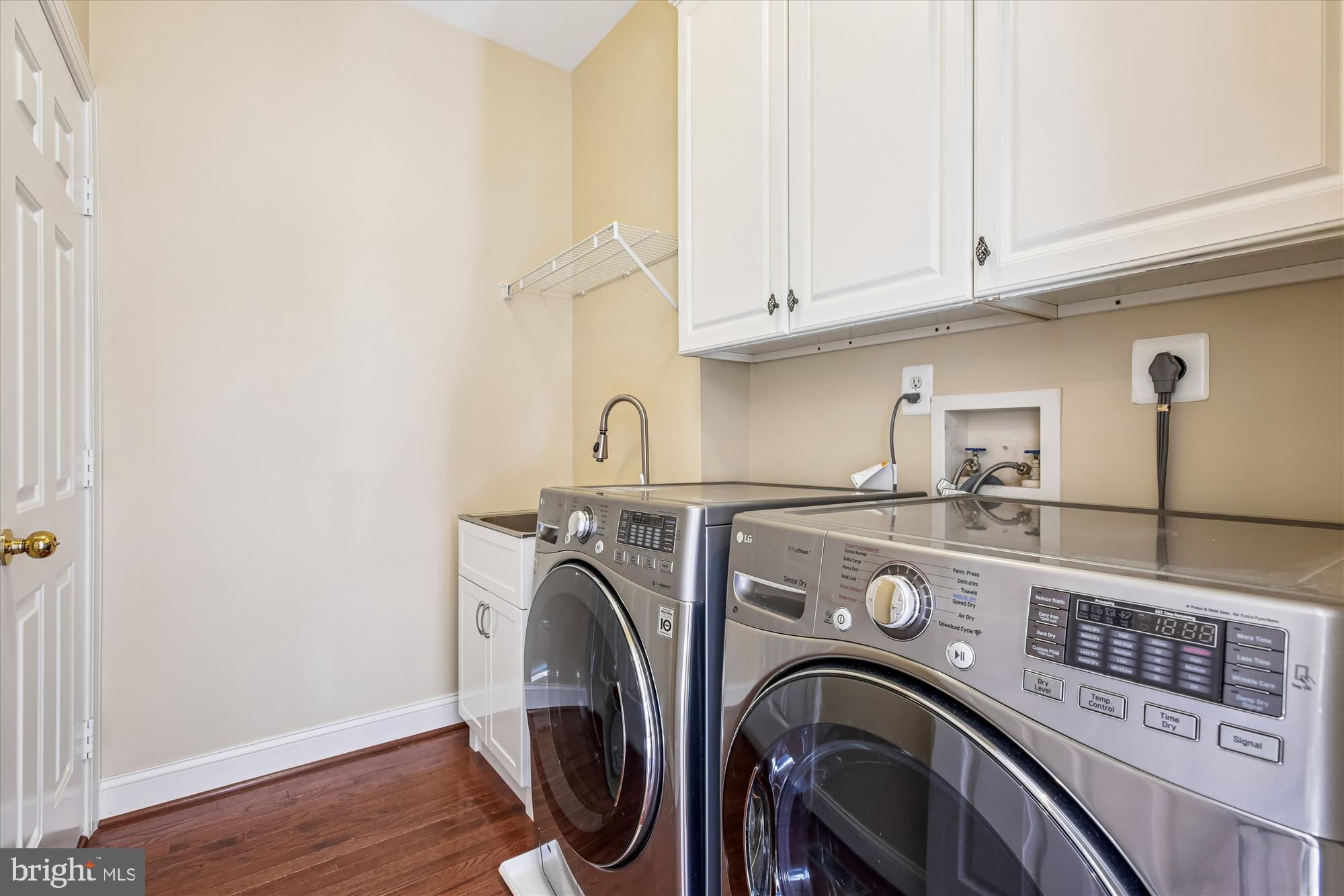 10606 Maplecrest Lane Potomac, MD 20854 - Photo 19 of 47 a utility room with dryer and washer