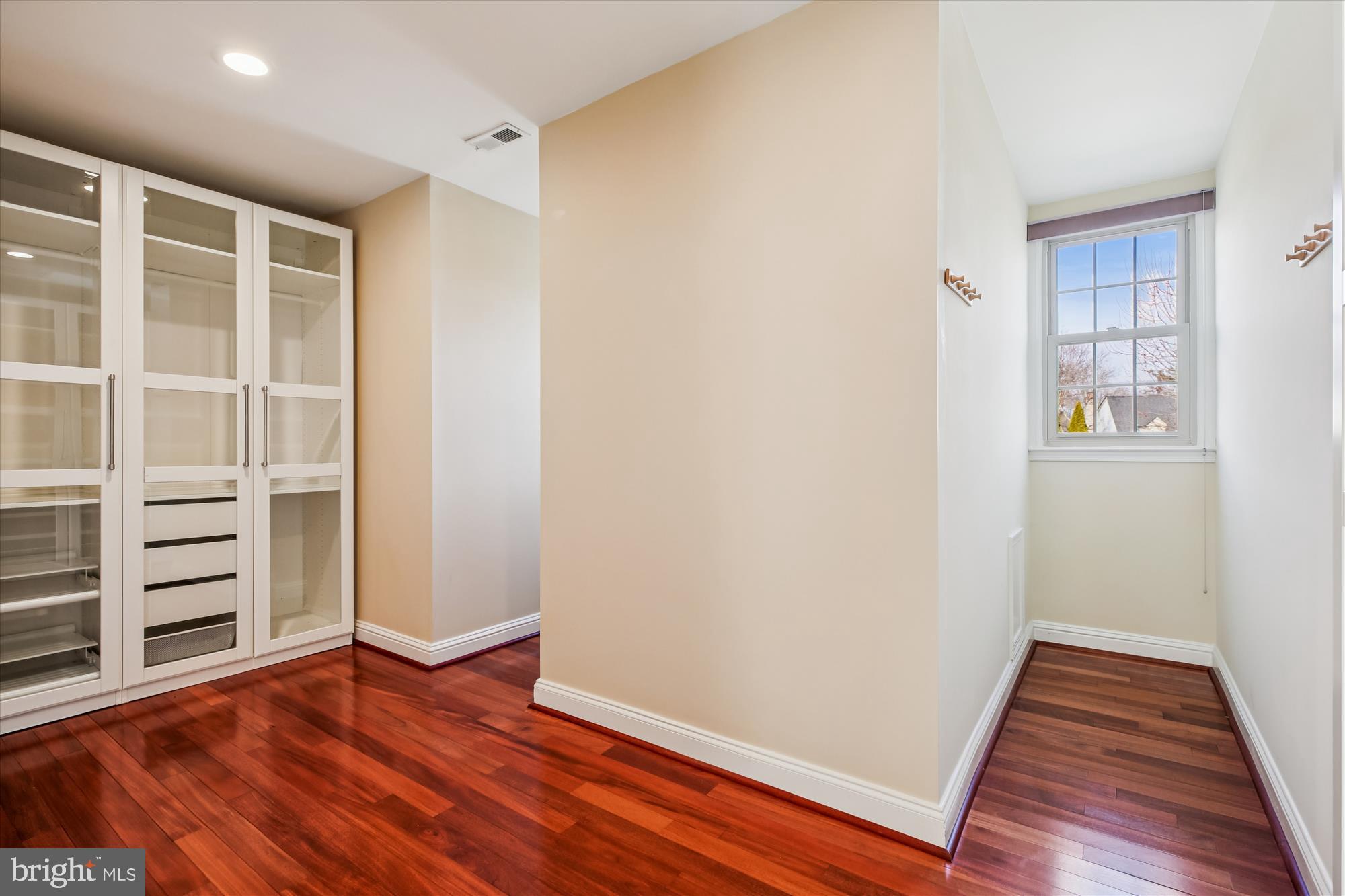 10606 Maplecrest Lane Potomac, MD 20854 - Photo 28 of 47 wooden floor in an empty room with a window