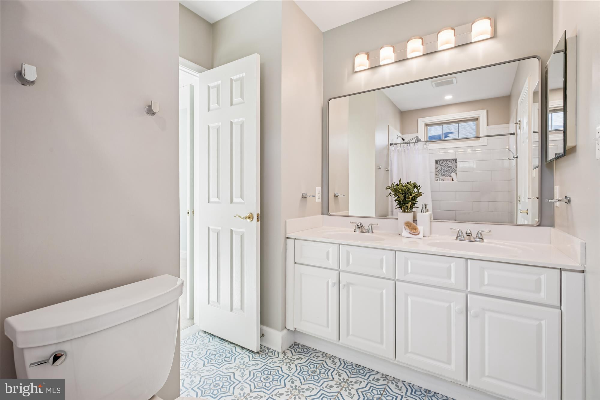 10606 Maplecrest Lane Potomac, MD 20854 - Photo 33 of 47 a bathroom with a sink a toilet and shower