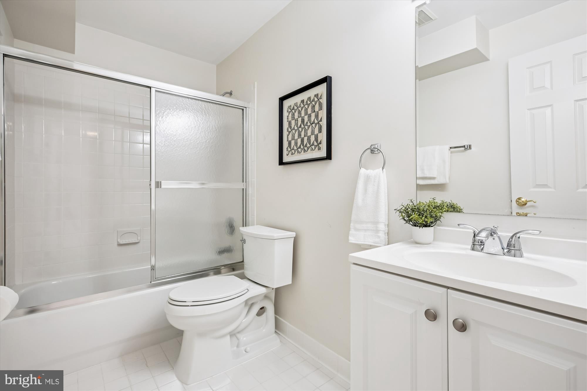 10606 Maplecrest Lane Potomac, MD 20854 - Photo 40 of 47 a bathroom with a toilet sink and shower