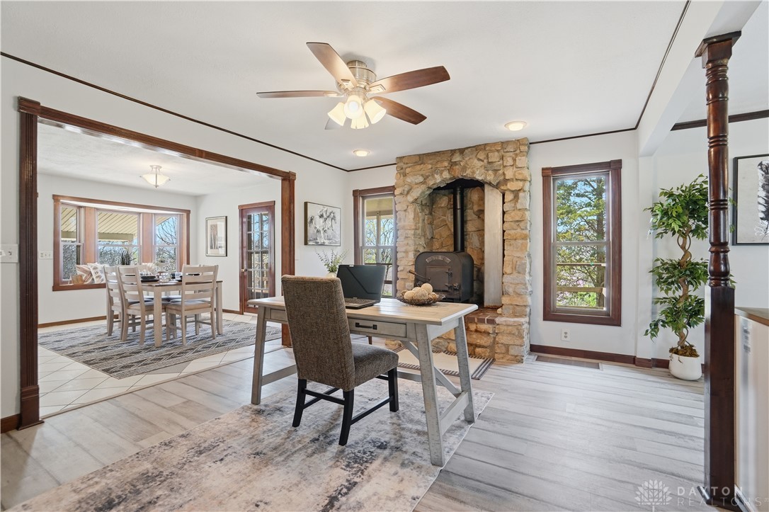 7553 Coffin Station Road Springfield, OH 45502 - Photo 34 of 95 Warm and inviting interiors with a cozy stone fireplace, perfect for tranquil living and entertaining.