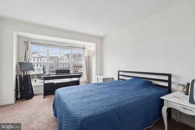 a room with a bed and a desk