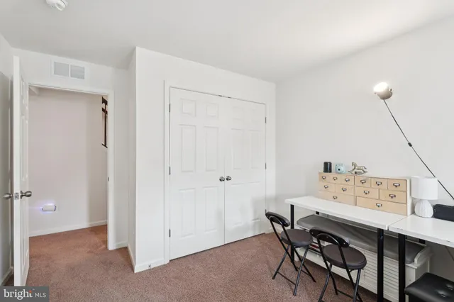 a view of a workspace with furniture