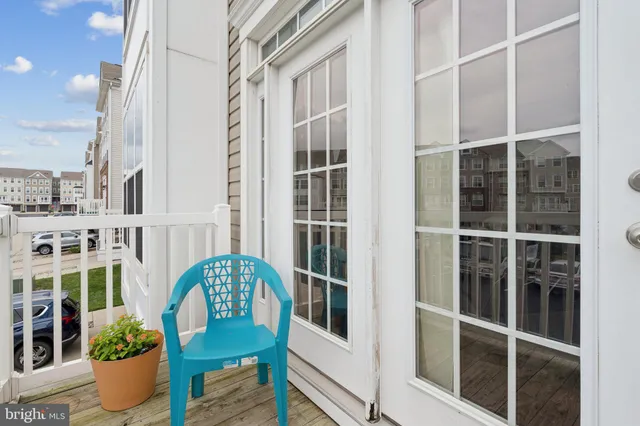a view of a balcony with an outdoor seating