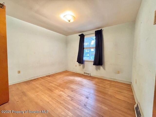 1004 Sleepy Hollow Road Clarks Summit, PA 18411 - Photo 11 of 24 an empty room with wooden floor and windows