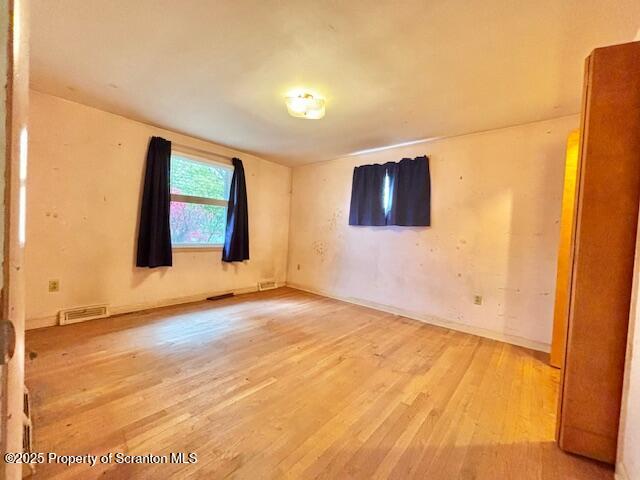 1004 Sleepy Hollow Road Clarks Summit, PA 18411 - Photo 12 of 24 a view of an empty room with wooden floor and a window