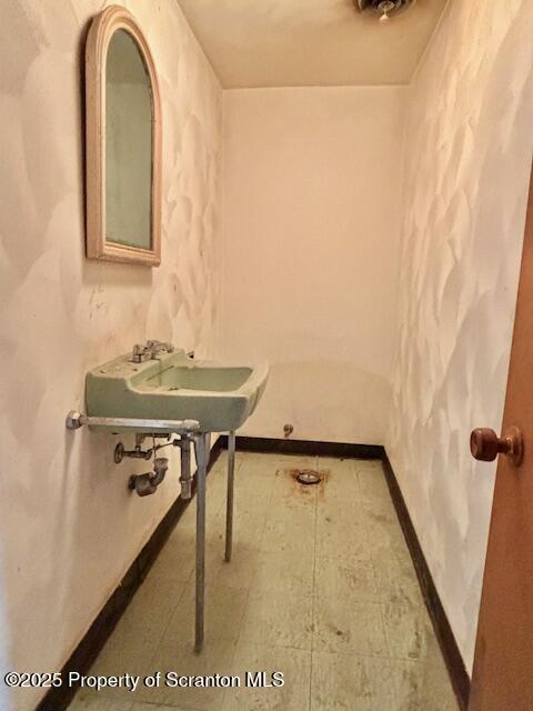 1004 Sleepy Hollow Road Clarks Summit, PA 18411 - Photo 19 of 24 a bathroom with a sink and a mirror