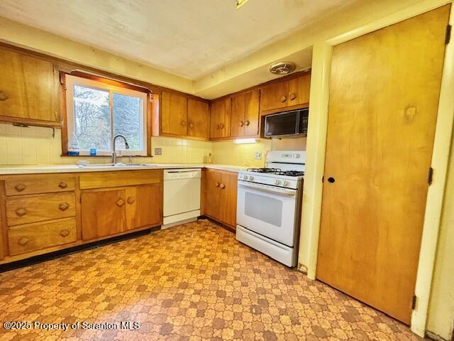 1004 Sleepy Hollow Road Clarks Summit, PA 18411 - Photo 5 of 24 a kitchen with stainless steel appliances granite countertop a stove a sink and a refrigerator