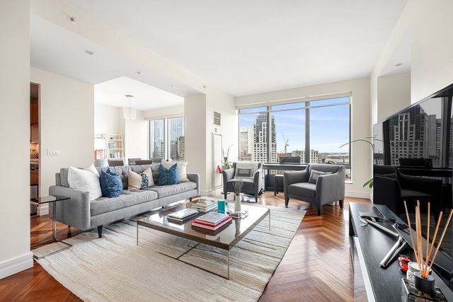 a living room with furniture fireplace and a flat screen tv