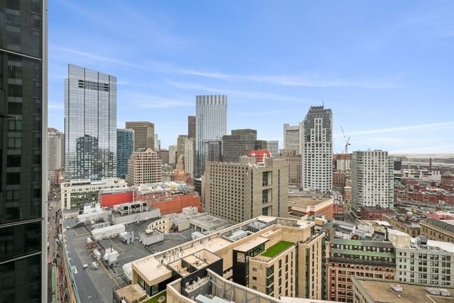 a view of a palm tree next to a building