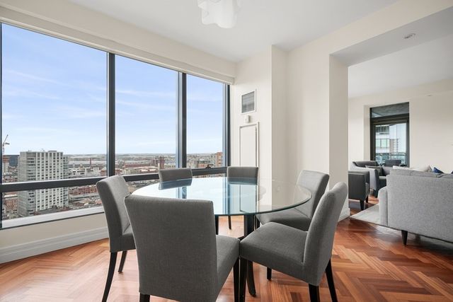a view of a dining room with furniture and window