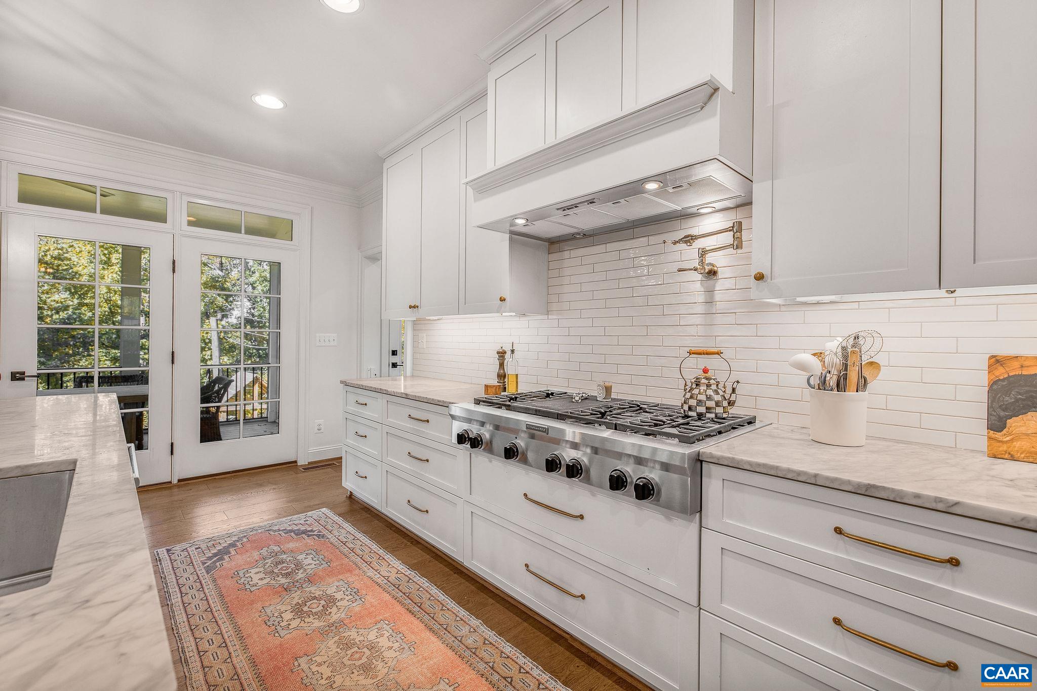 1421 Dairy Road Charlottesville, VA 22903 - Photo 15 of 57 a kitchen with stainless steel appliances granite countertop a stove and a white cabinets