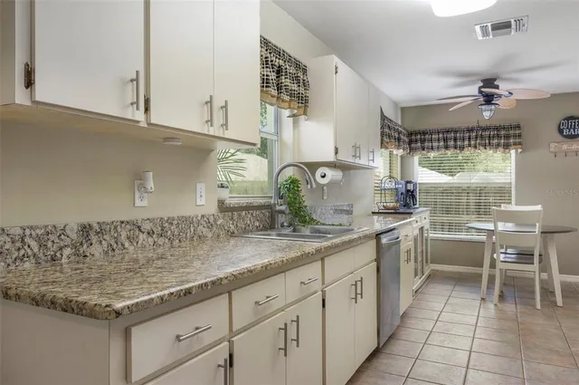 a kitchen with a sink and cabinets