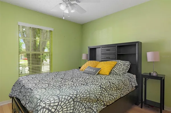 a bedroom with a bed and window