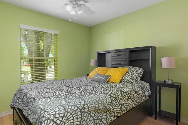 a bedroom with a bed and window